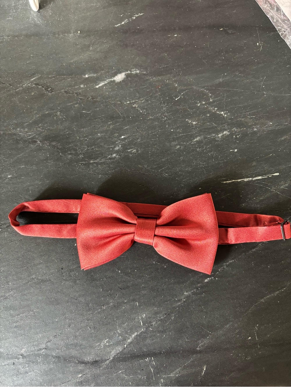 Azazie men’s matte satin terracotta bow tie. I have 4 available. $10 each